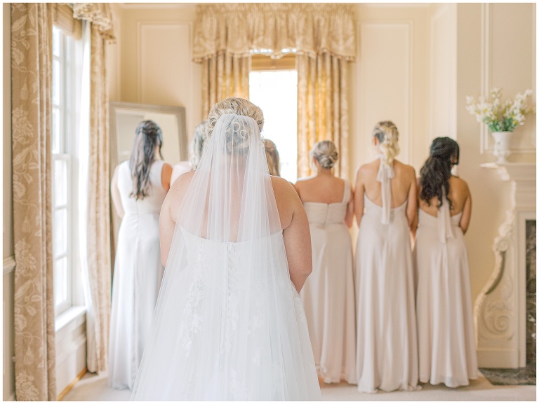 Bride and bridesmaids about to do a first look